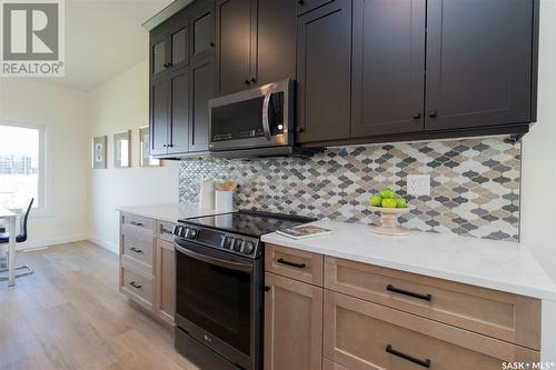 1023 Glacial Shores Common, Saskatoon, SK - Indoor Photo Showing Kitchen With Upgraded Kitchen