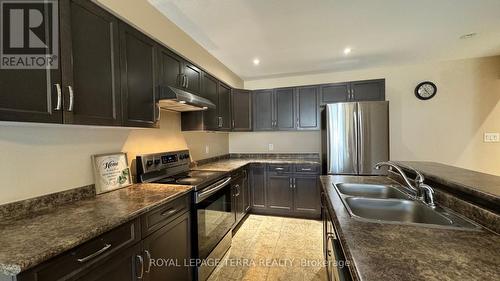 150 - 7607 Green Vista Gate, Niagara Falls, ON - Indoor Photo Showing Kitchen With Double Sink