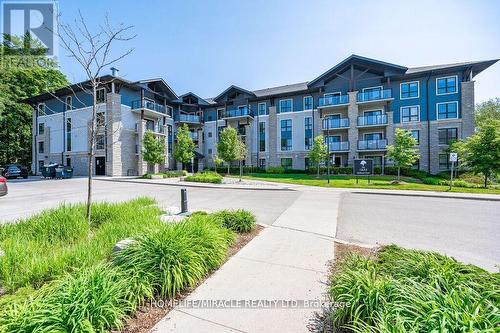 413 - 50 Bryan Court, Kitchener, ON - Outdoor With Balcony With Facade