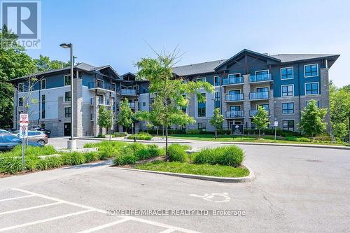 413 - 50 Bryan Court, Kitchener, ON - Outdoor With Balcony With Facade