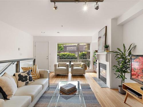 8-821 Tyee Rd, Victoria, BC - Indoor Photo Showing Living Room With Fireplace