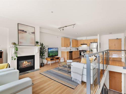 8-821 Tyee Rd, Victoria, BC - Indoor Photo Showing Living Room With Fireplace