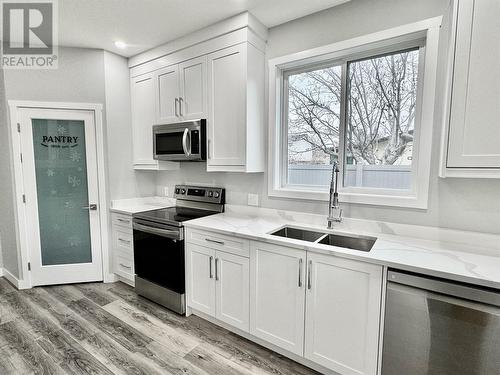 5830 Okanagan Street Unit# 102, Oliver, BC - Indoor Photo Showing Kitchen With Stainless Steel Kitchen With Double Sink