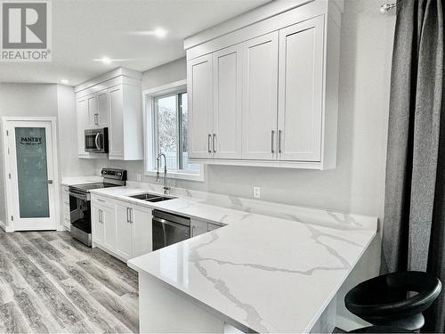 5830 Okanagan Street Unit# 102, Oliver, BC - Indoor Photo Showing Kitchen With Double Sink