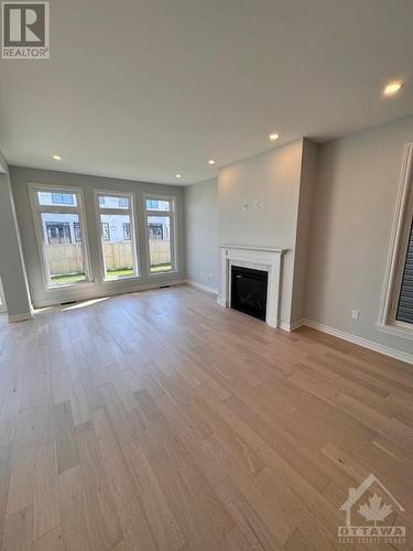 906 Echinacea Row, Ottawa, ON - Indoor Photo Showing Living Room With Fireplace