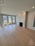 906 Echinacea Row, Ottawa, ON  - Indoor Photo Showing Living Room With Fireplace 