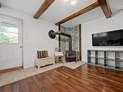 Family room - 35 Rue Du Plateau, Mont-Blanc, QC - Indoor Photo Showing Other Room With Fireplace