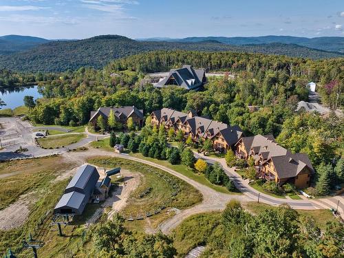 Aerial photo - 10-1520 Ch. Du Versant-Soleil, Mont-Tremblant, QC - Outdoor With Body Of Water With View