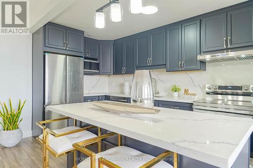 1209 - 1950 Kennedy Road, Toronto (Dorset Park), ON - Indoor Photo Showing Kitchen With Stainless Steel Kitchen