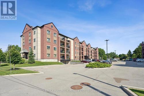 304 - 157 Wellington Street E, New Tecumseth (Alliston), ON - Outdoor With Balcony With Facade