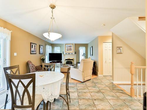 Dinette - 12 Ch. De Rambervillers, Lorraine, QC - Indoor Photo Showing Dining Room With Fireplace