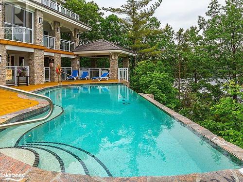 Infinity Pool at Main Lodge - 1869 Highway 118 West Unit# Bhv-B203, Muskoka Lakes, ON - Outdoor With In Ground Pool With Backyard