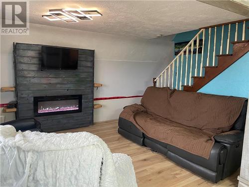 11 Sur L' Ocean, Grand-Barachois, NB - Indoor Photo Showing Living Room With Fireplace