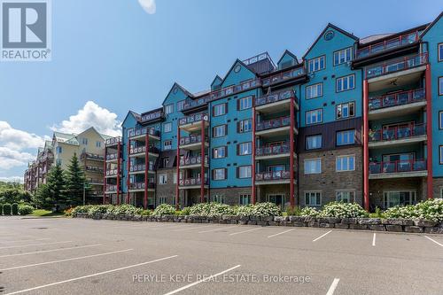 204 - 130 Steamship Bay Road, Gravenhurst, ON - Outdoor With Balcony With Facade