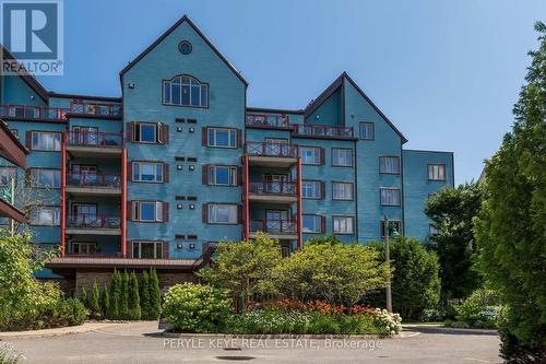 204 - 130 Steamship Bay Road, Gravenhurst, ON - Outdoor With Balcony With Facade