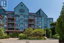 204 - 130 Steamship Bay Road, Gravenhurst, ON  - Outdoor With Balcony With Facade 