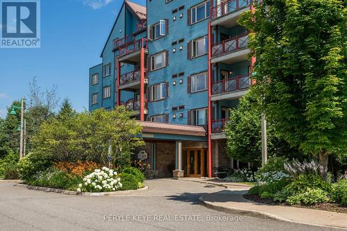 204 - 130 Steamship Bay Road, Gravenhurst, ON - Outdoor With Balcony With Facade