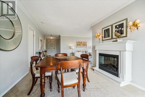 605 - 20 Southport Street, Toronto (High Park-Swansea), ON - Indoor Photo Showing Dining Room With Fireplace