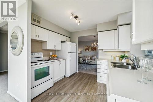 605 - 20 Southport Street, Toronto (High Park-Swansea), ON - Indoor Photo Showing Kitchen With Double Sink