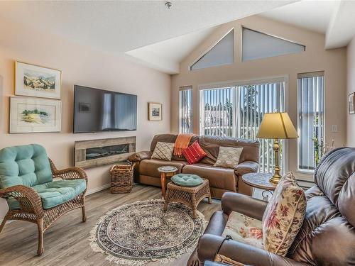 301-750 Memorial Ave, Qualicum Beach, BC - Indoor Photo Showing Living Room With Fireplace