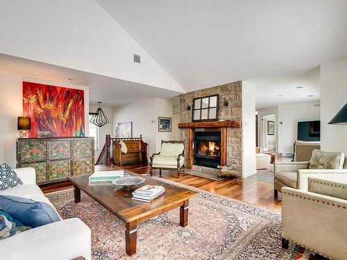 Salon - 15 Av. D'Amiens, Estérel, QC - Indoor Photo Showing Living Room With Fireplace