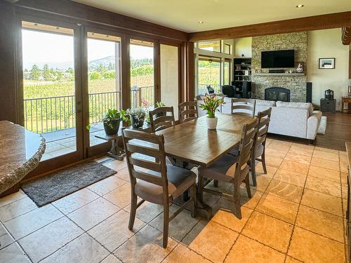 3175 Valleyview Road, Penticton, BC - Indoor Photo Showing Dining Room With Fireplace