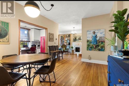 414 2305 Victoria Avenue, Regina, SK - Indoor Photo Showing Dining Room With Fireplace