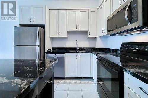 714 - 2490 Old Bronte Road, Oakville (Palermo West), ON - Indoor Photo Showing Kitchen With Double Sink