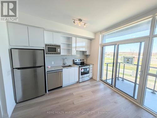 218 - 60 George Butchart Drive N, Toronto (Downsview-Roding-Cfb), ON - Indoor Photo Showing Kitchen