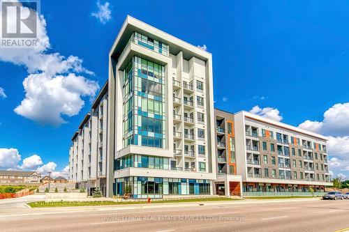 216 - 95 Dundas Street W, Oakville, ON - Outdoor With Balcony With Facade