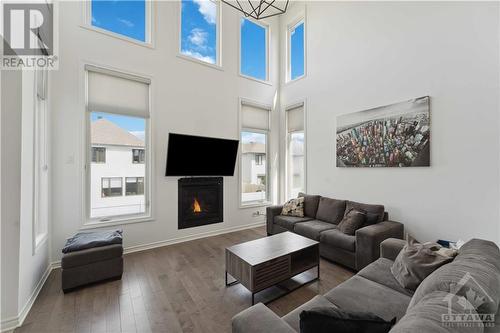 96 Dun Skipper Drive, Ottawa, ON - Indoor Photo Showing Living Room With Fireplace