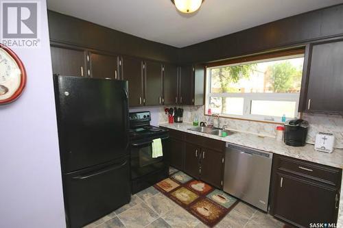 702 Second Street, Estevan, SK - Indoor Photo Showing Kitchen With Double Sink