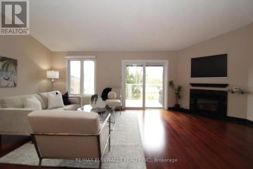 24 - 90 Ontario Street S, Lambton Shores (Grand Bend), ON - Indoor Photo Showing Living Room With Fireplace