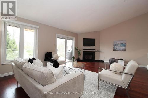 24 - 90 Ontario Street S, Lambton Shores (Grand Bend), ON - Indoor Photo Showing Living Room With Fireplace