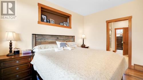 2621 Brewer  Rise Ridge, Invermere, BC - Indoor Photo Showing Bedroom With Fireplace