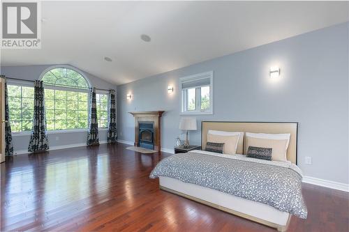 AI image - 11 Behnke Crescent, Pembroke, ON - Indoor Photo Showing Bedroom With Fireplace