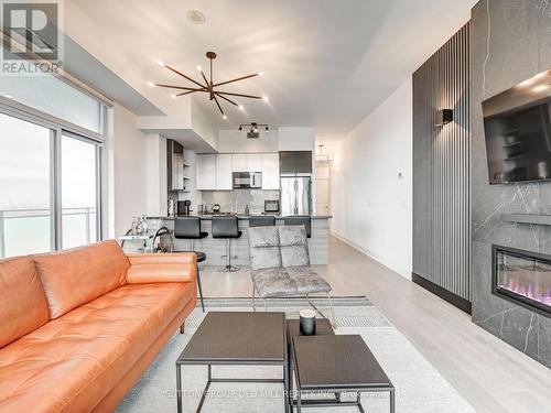 Lph3704 - 33 Shore Breeze Drive, Toronto (Mimico), ON - Indoor Photo Showing Living Room With Fireplace