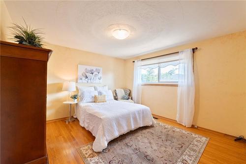 Secondary bedroom with large window - 185 Nugent Drive, Hamilton, ON - Indoor Photo Showing Bedroom