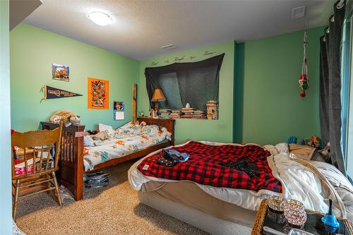 6205 6 Highway, Coldstream, BC - Indoor Photo Showing Bedroom