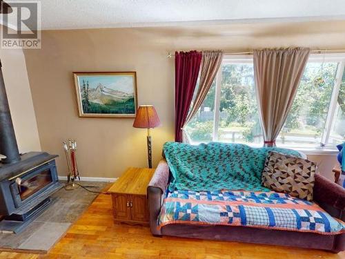 10288 Kelly Creek Road, Powell River, BC - Indoor Photo Showing Bedroom With Fireplace