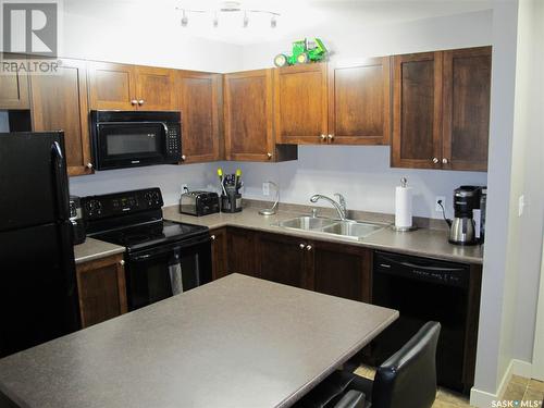 407 306 Petterson Drive, Estevan, SK - Indoor Photo Showing Kitchen With Double Sink