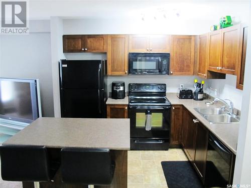 407 306 Petterson Drive, Estevan, SK - Indoor Photo Showing Kitchen With Double Sink