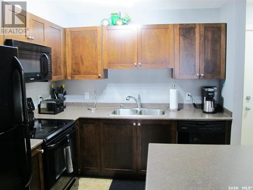 407 306 Petterson Drive, Estevan, SK - Indoor Photo Showing Kitchen With Double Sink