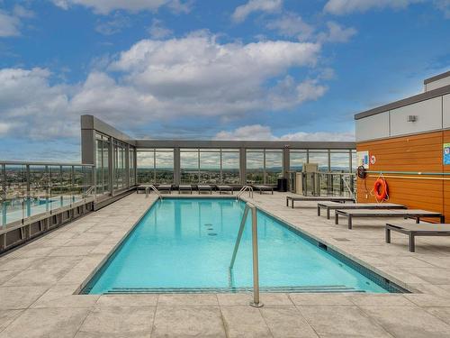 Piscine - 1203-3647 Av. Jean-Béraud, Laval (Chomedey), QC - Outdoor With In Ground Pool With Deck Patio Veranda With View