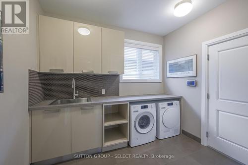 main floor laundry w/ built-ins & Miele wash/dry - 1 - 570 Windermere Road, London, ON - Indoor Photo Showing Laundry Room