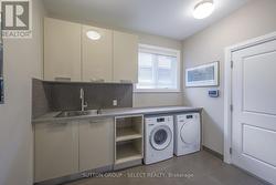 main floor laundry w/ built-ins & Miele wash/dry - 