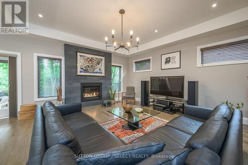 spacious living room with fireplace & tray ceiling - 1 - 570 Windermere Road, London, ON - Indoor Photo Showing Living Room With Fireplace