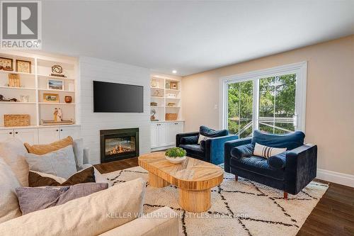 Shiplap fireplace, new sliding door (2023) - 411 Lawson Road, London, ON - Indoor Photo Showing Living Room With Fireplace