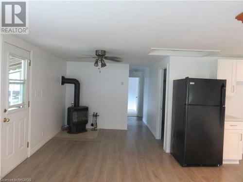 303 W Sauk Court Nw, Point Clark, ON - Indoor Photo Showing Kitchen With Fireplace