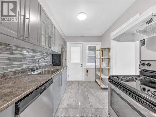 92-94 Hanna Street, Windsor, ON - Indoor Photo Showing Kitchen With Double Sink